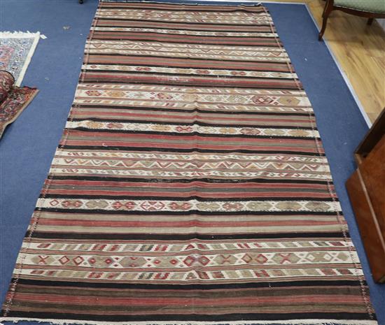A Persian kelim 320 x 155cm